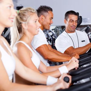 Two men and two women in a group fitness class.